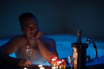 Image showing man relaxing in the jacuzzi