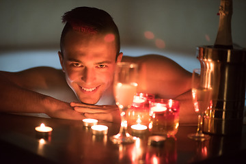 Image showing man relaxing in the jacuzzi