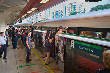 Image showing People boarding subway train. Singapore