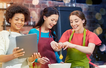 Image showing happy women with tablet pc in kitchen