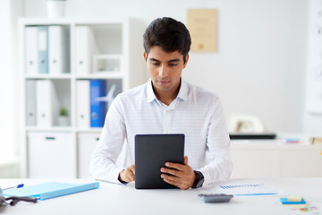 Image showing businessman working with tablet pc at office