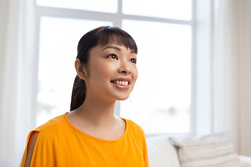 Image showing portrait of smiling young asian woman at home