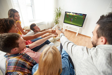 Image showing friends with beer watching football or soccer game