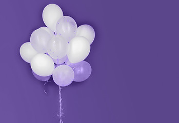 Image showing white helium balloons on ultra violet background