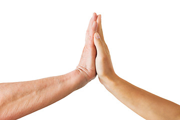 Image showing close up of senior and young woman touching hands