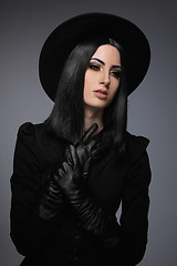 Image showing Beautiful High Fashion Model Wearing Black Hte and Leather Glove