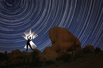 Image showing Beautiful Model Lit With Light Tube With North Star Trails in Jo