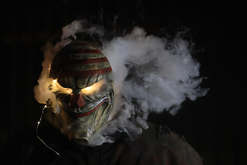 Image showing Man Wearing a Mask With Smoke and Lights