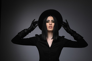 Image showing Beautiful High Fashion Model Wearing Black Hte and Leather Glove