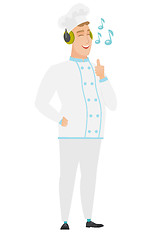 Image showing Chef cook listening to music in headphones.