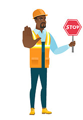 Image showing African-american builder holding stop road sign.