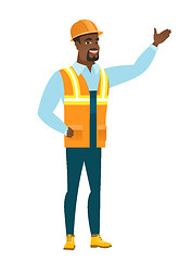 Image showing African-american builder showing a direction.