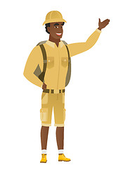 Image showing African-american traveler showing a direction.