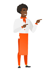 Image showing African-american chef cook pointing to the side.