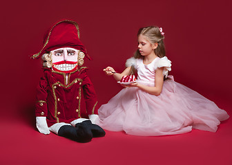 Image showing The beauty ballerina standing with nutcracker