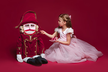 Image showing The beauty ballerina standing with nutcracker