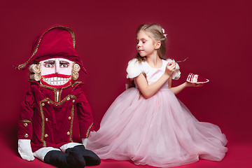 Image showing The beauty ballerina standing with nutcracker