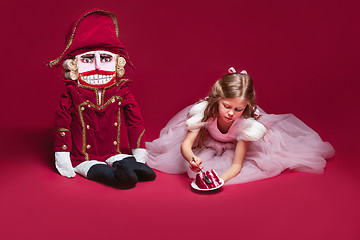 Image showing The beauty ballerina standing with nutcracker