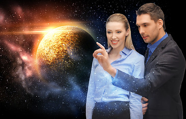 Image showing businessman and businesswoman over space