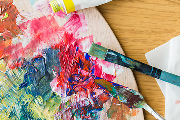 Image showing palette knife or painting spatula and paintbrush