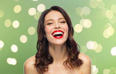 Image showing beautiful laughing young woman with red lipstick