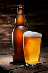 Image showing Beer on wooden background