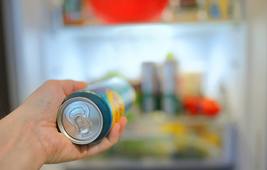 Image showing Man taking beer from fridge