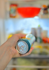 Image showing Man taking beer from fridge