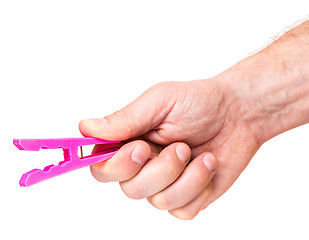 Image showing Hand with color clothespin