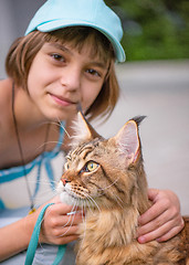 Image showing Girl with cat in park