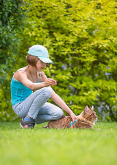 Image showing Girl with cat in park