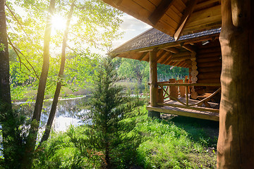 Image showing Wooden house and river