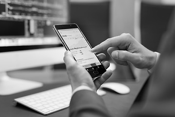 Image showing Close up of businessman using mobile smart phone.