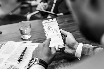 Image showing Close up of businessman using mobile smart phone.