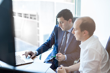 Image showing Business team brainstorming and dicussing business ideas at business meeting.