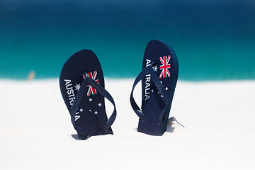 Image showing Australia Flag thongs in the sand by the beach in summer