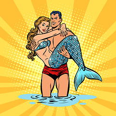 Image showing Couple in love. Mermaid and handsome male swimmer