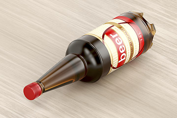 Image showing Beer bottle on wood background