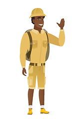 Image showing Young african-american traveler waving his hand.