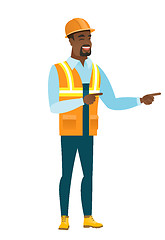 Image showing African-american builder pointing to the side.