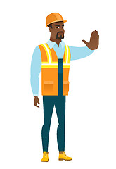 Image showing African-american builder showing stop hand gesture