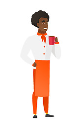 Image showing African-american chef cook holding cup of coffee.