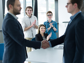 Image showing cloasing the deal in modern office interior