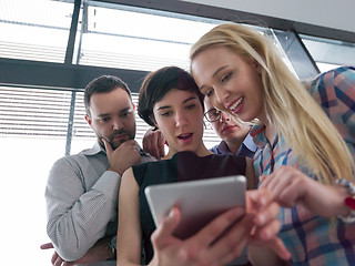 Image showing group of Business People Working With Tablet in startup office