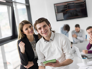 Image showing Two Business People Working With Tablet in office