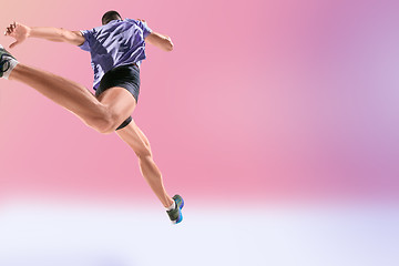 Image showing The studio shot of high jump athlete is in action