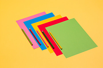 Image showing colored pencils and colour paper