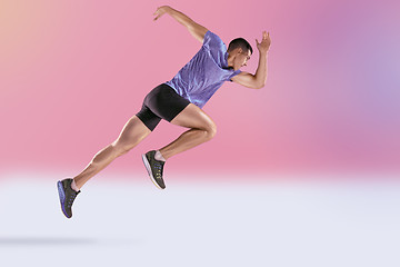 Image showing The studio shot of high jump athlete is in action