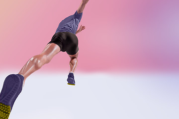 Image showing The studio shot of high jump athlete is in action