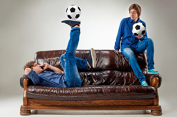 Image showing The two guys with balls on gray background